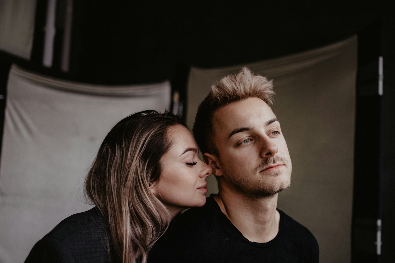 man in black crew neck shirt beside woman in black crew neck shirt